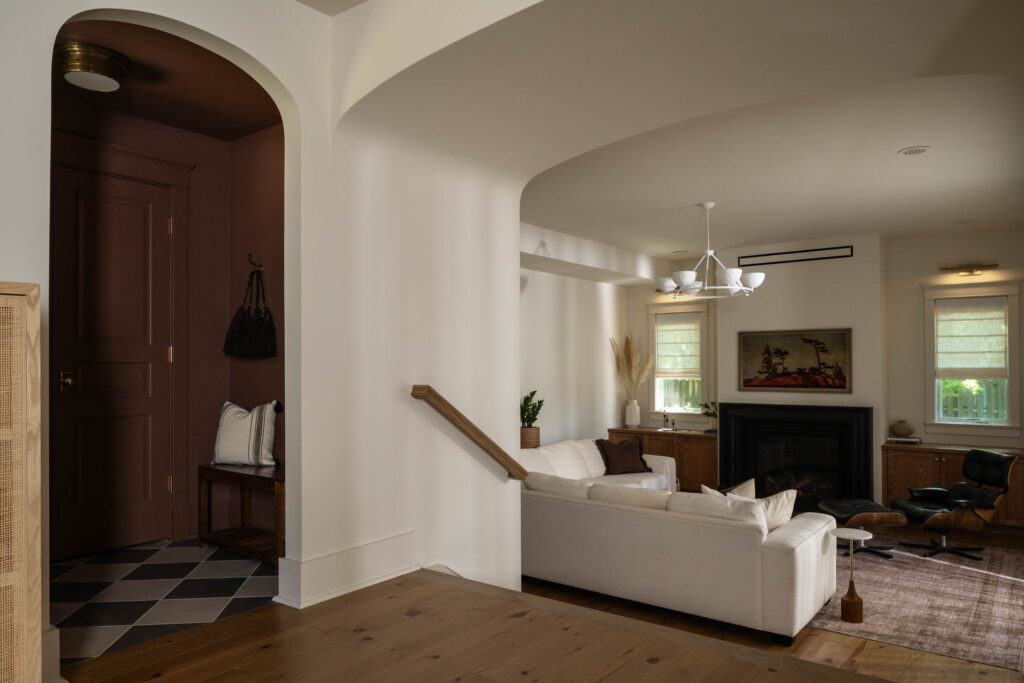 Curved openings connecting the entry and living room at Project Bellview