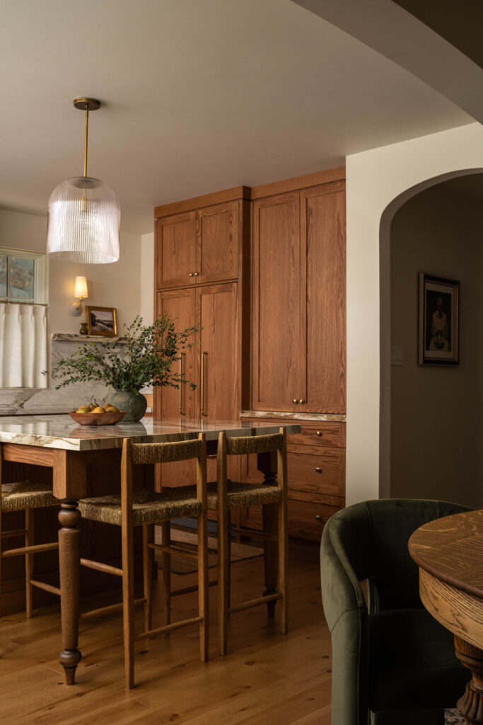 Custom wood cabinetry and stone-topped kitchen island at Project Bellview
