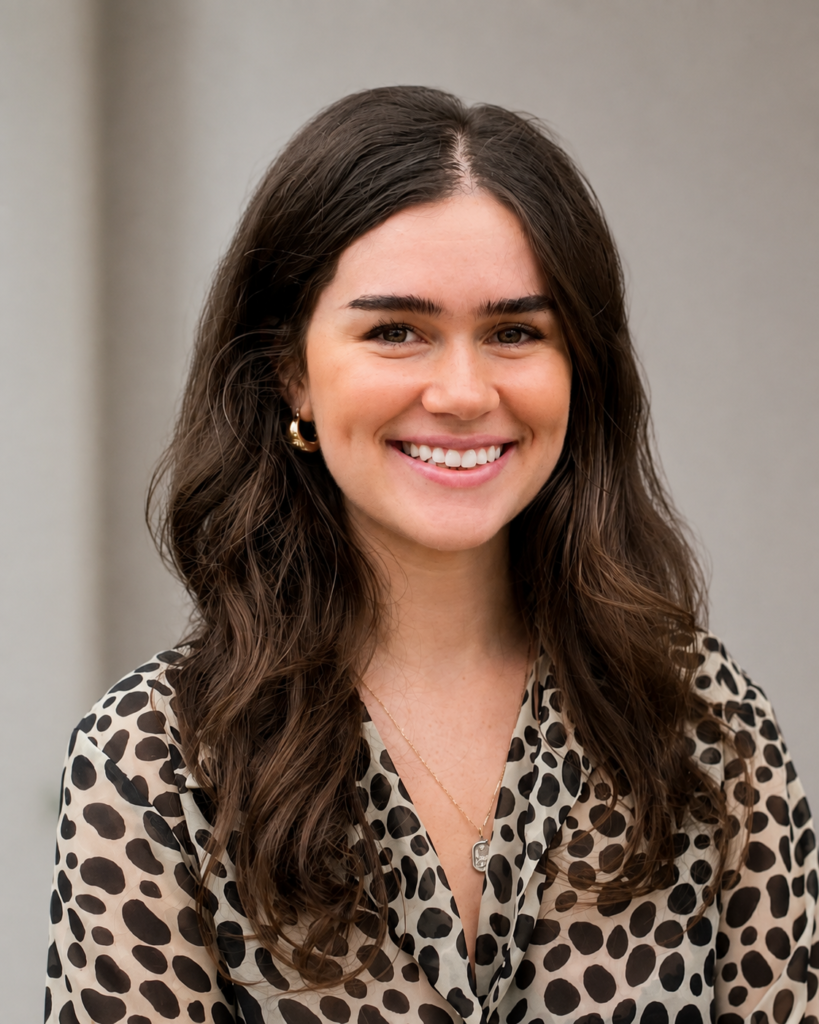Professional headshot of Sarah Waites, Junior Designer at Catlin Design Build, smiling against a neutral background.
